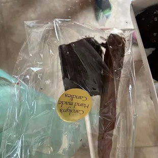 Dark chocolate rice crispy and chocolate caramel covered pretzel.