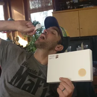 Eating the very last one.