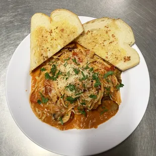 a plate of pasta and bread