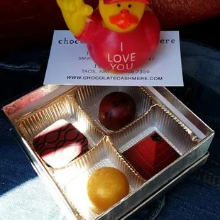 a box of chocolates and a rubber duck