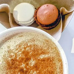 a cup of coffee and a macaron