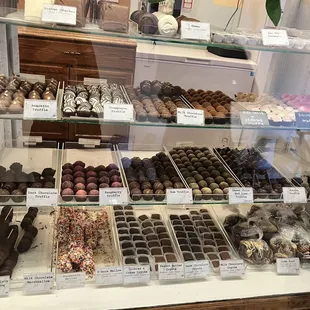 a variety of chocolates in a display case