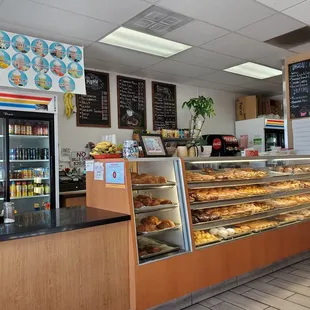Main counter filled with fresh donuts and pastries.