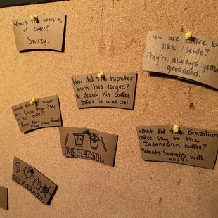 a cork board with notes pinned to it