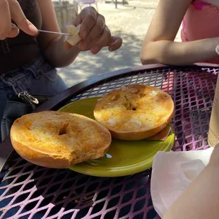 two donuts on a green plate