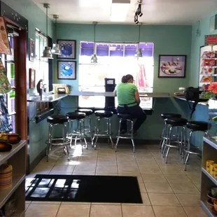 a woman sitting at a counter