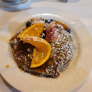 Blue corn pancakes with blueberry and a brown sugar pinon syrup.