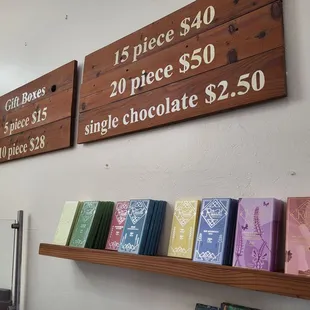 a display of chocolates on wooden shelves
