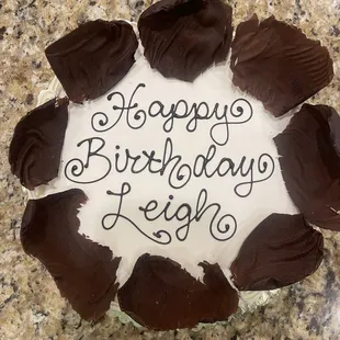 Chocolate birthday cake with butter cream icing.