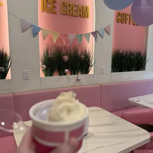 Split scoop in a cup. Table seating area.