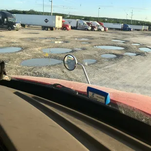 Lots of parking, paved and dirt, beware of all the holes