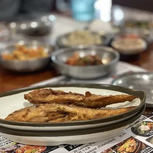 a plate of fried fish