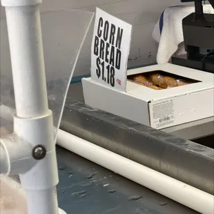 a box of donuts on a conveyor belt