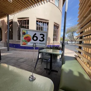 a table and chairs outside a restaurant