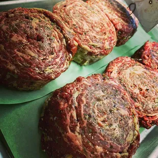 Pinwheels - Tenderized skirt steak seasoned and rolled into pinwheels