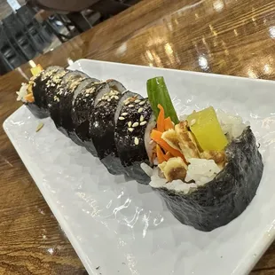 a plate of sushi on a table