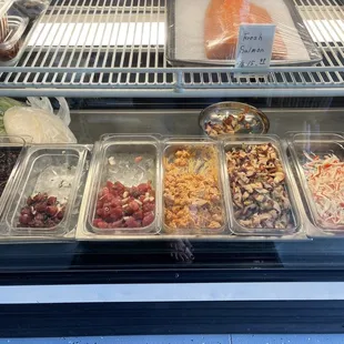 a variety of foods in a display case