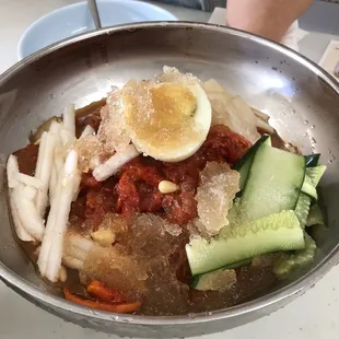 Nem myung.  Cold spicy noodle. Or can be ordered not spicy.
