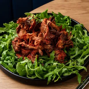 Fried Oyster Mushrooms on top of Champagne Vinegared Arugula Salad