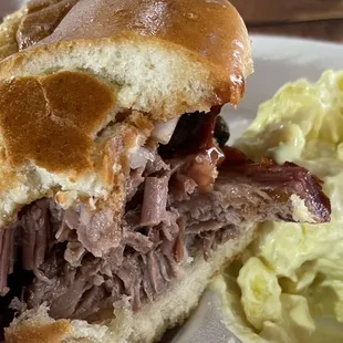 Brisket sandwich with potato salad.