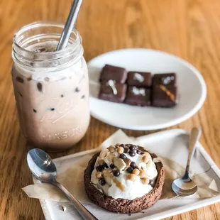 a cup of coffee and a dessert on a plate