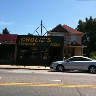 a car parked in front of a restaurant