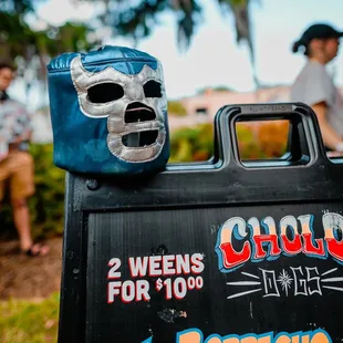 a sign with a mask on it