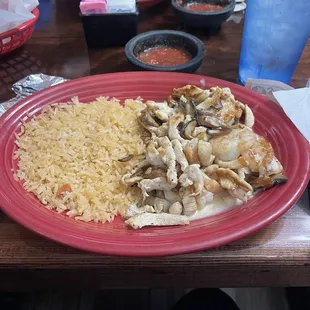 a plate of chicken and rice