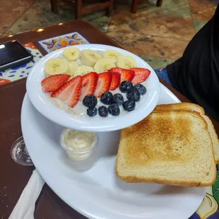 Oatmeal with fruit and bread pretty yummy