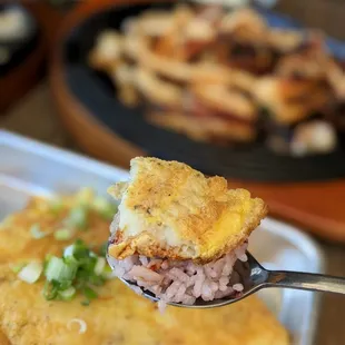 a closeup of a spoonful of food