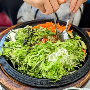 a person eating a salad