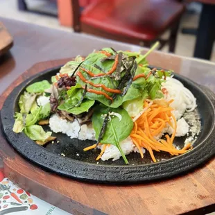 Dolsot-Bibimbap (rice and veggies over hot plate)