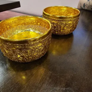 Water served in these gold bowls