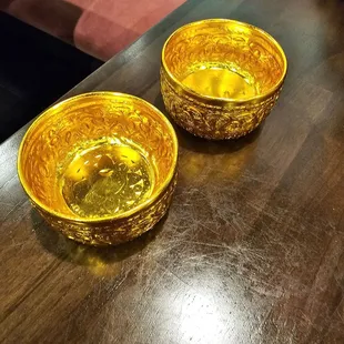 Water served in gold bowls