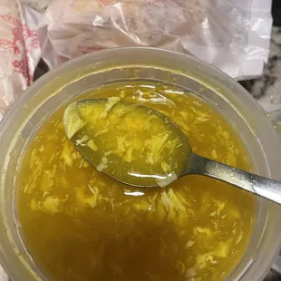 a bowl of soup with a spoon