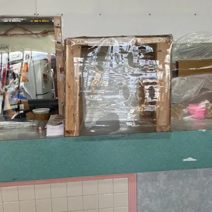 a view of a kitchen counter with plastic covering