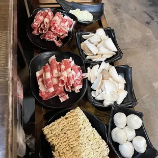 Hotpot beef, fish balls, ramen noodles, mushrooms, and egg tofu