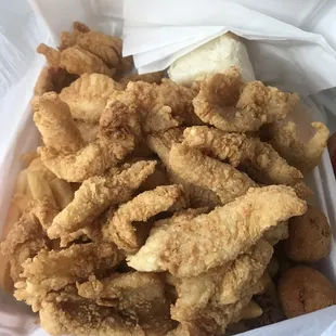 Catfish nugget dinner for 15.49 comes with fish, fries, hush puppies, salad, and dinner roll, and it's as good as it looks