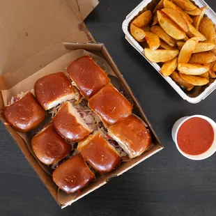 a box of french fries and a box of hotdogs