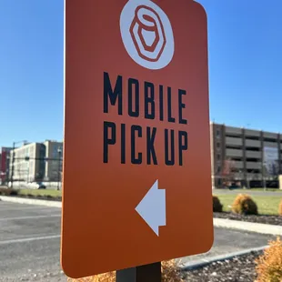 a mobile pick up sign in a parking lot