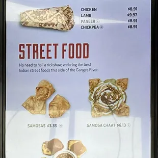Menu board up close: Tasty Wraps &amp; Street Food Items.