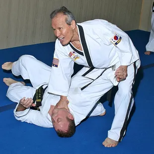 Grandmaster Choon Lee demonstrating a technique during class