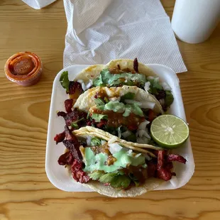 a plate of tacos on a table