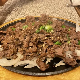 beef and onions on a plate