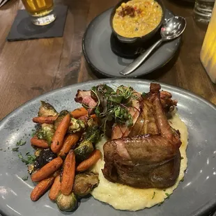 Smoked chicken with seasonal veggies.  Creamed corn side dish.