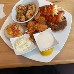 Shrimp scampi, coconut shrimp, crab cake, and lobster.