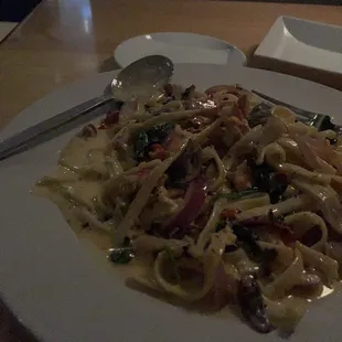 Lobster Pasta with sun dried tomatoes, onions, mushrooms, and spinach.