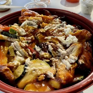 Chicken bowl with garlic &amp; pomegranate sauces.