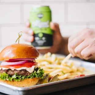 Chop House Burger-Black summer truffle sauce, shaved red onion, vine ripened tomato, green leaf lettuce
