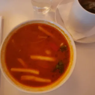 a bowl of soup and a cup of coffee